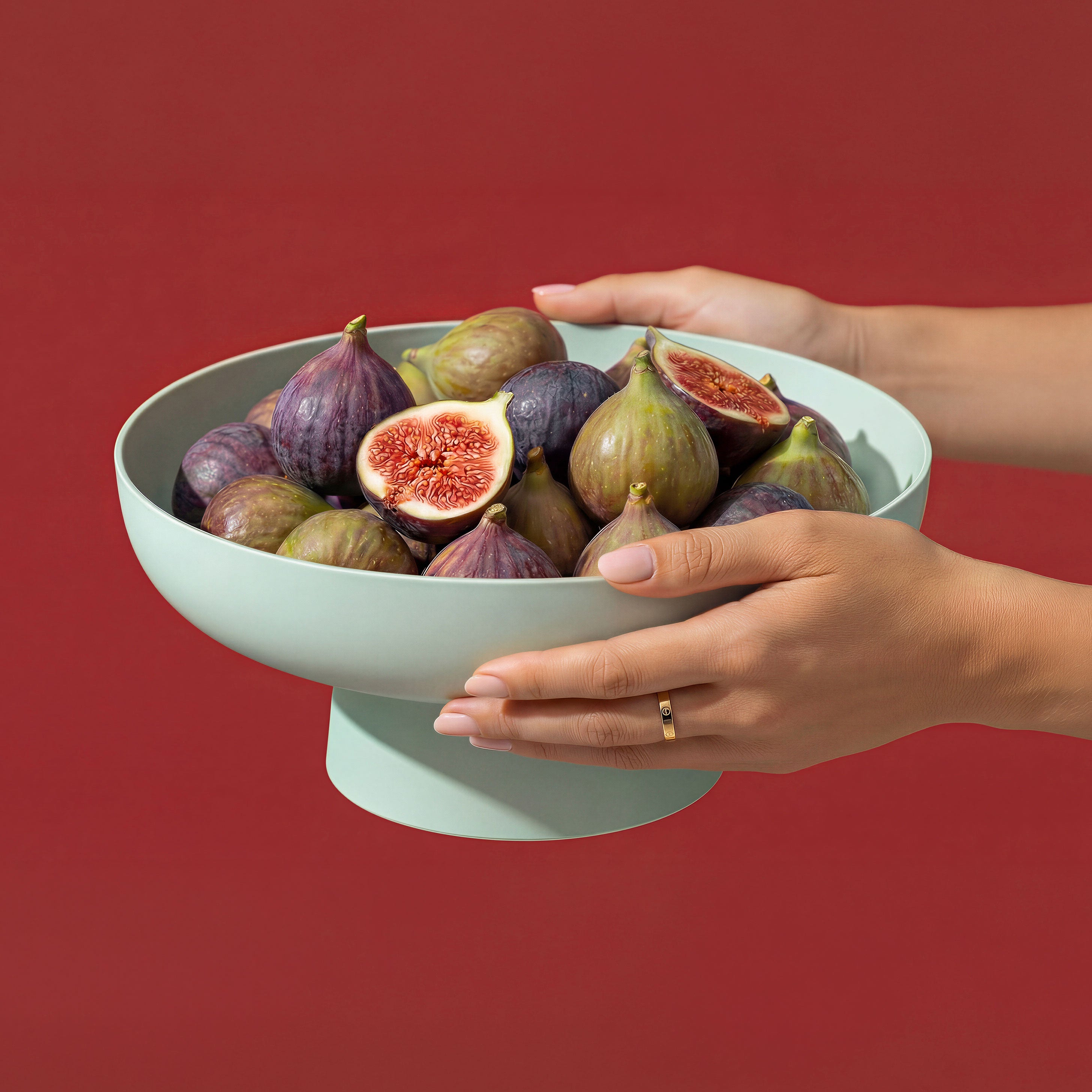 Large Runda Bowl in Sage by Maxim Vogel filled with fresh figs, styled as a sculptural matte fruit bowl.